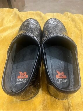 Dansko Black Floral-Embossed Slip-On Clogs